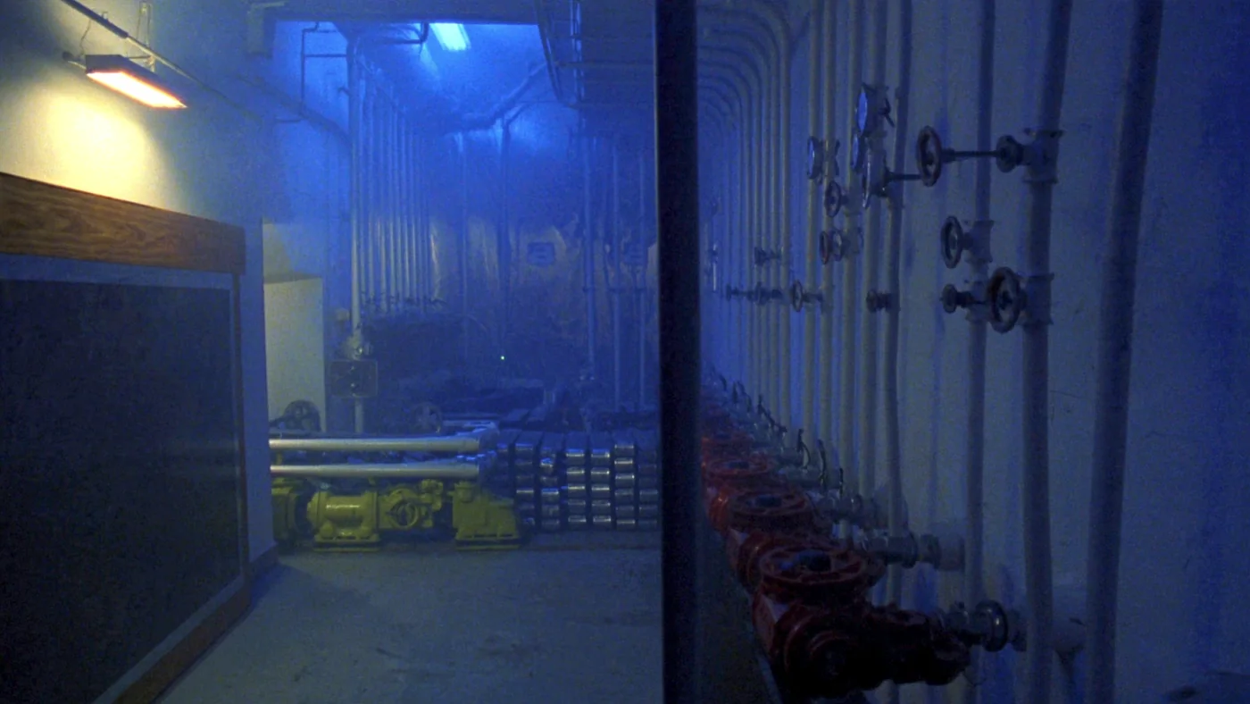 A district heating substation with pumps, valves and pressure gauges
